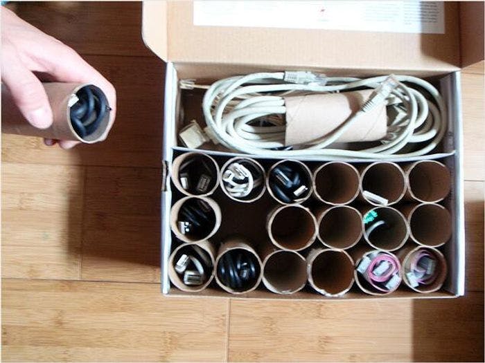 You can organize cables inside of empty toilet paper rolls.