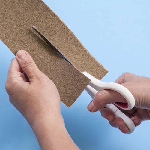 Sharpen scissors by cutting a few pieces of sandpaper.