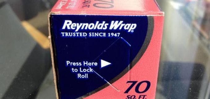 Almost every box of aluminum foil and plastic wrap comes with end locks to keep the roll in place and distributing smoothly.