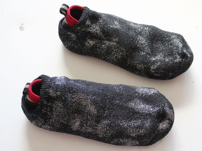 Prevent yourself from slipping in the snow by putting your socks over your shoes.